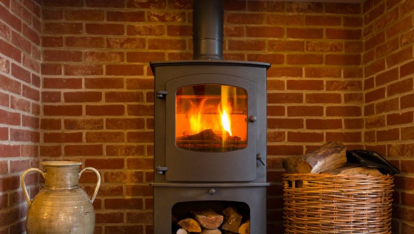 How do I clean my ceramic wood stove glass?